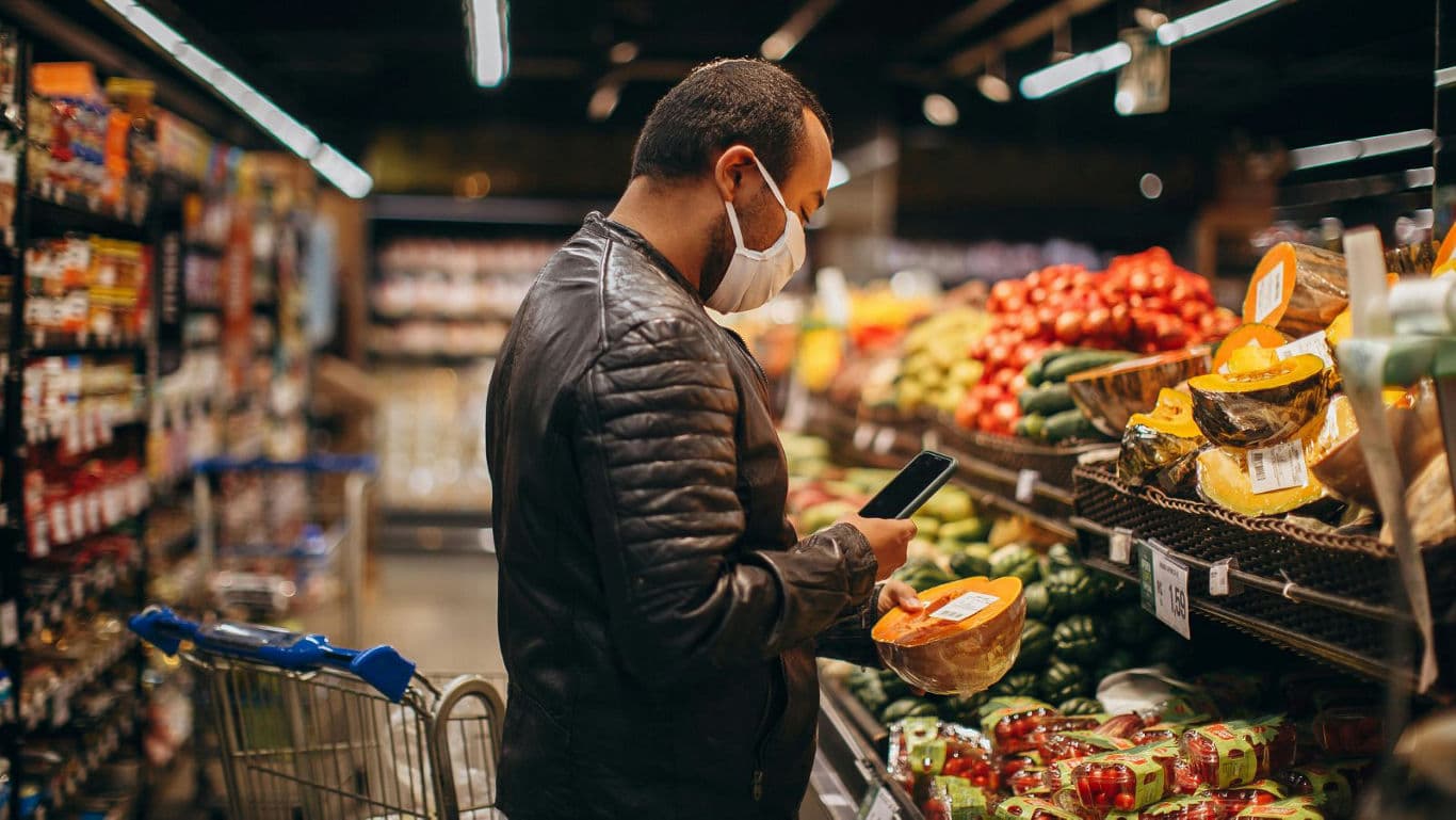 Man shopping for fresh produce in grocery store