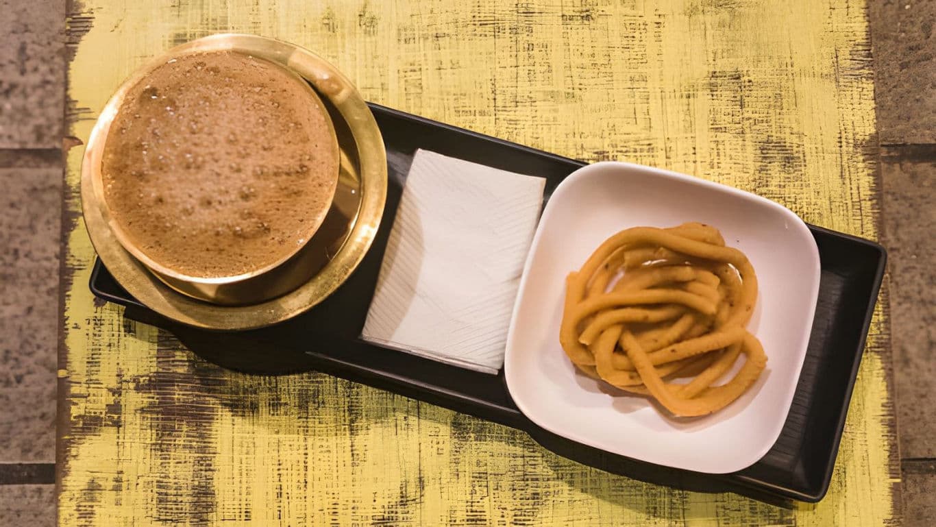 Traditional South Indian coffee with jalebi dessert