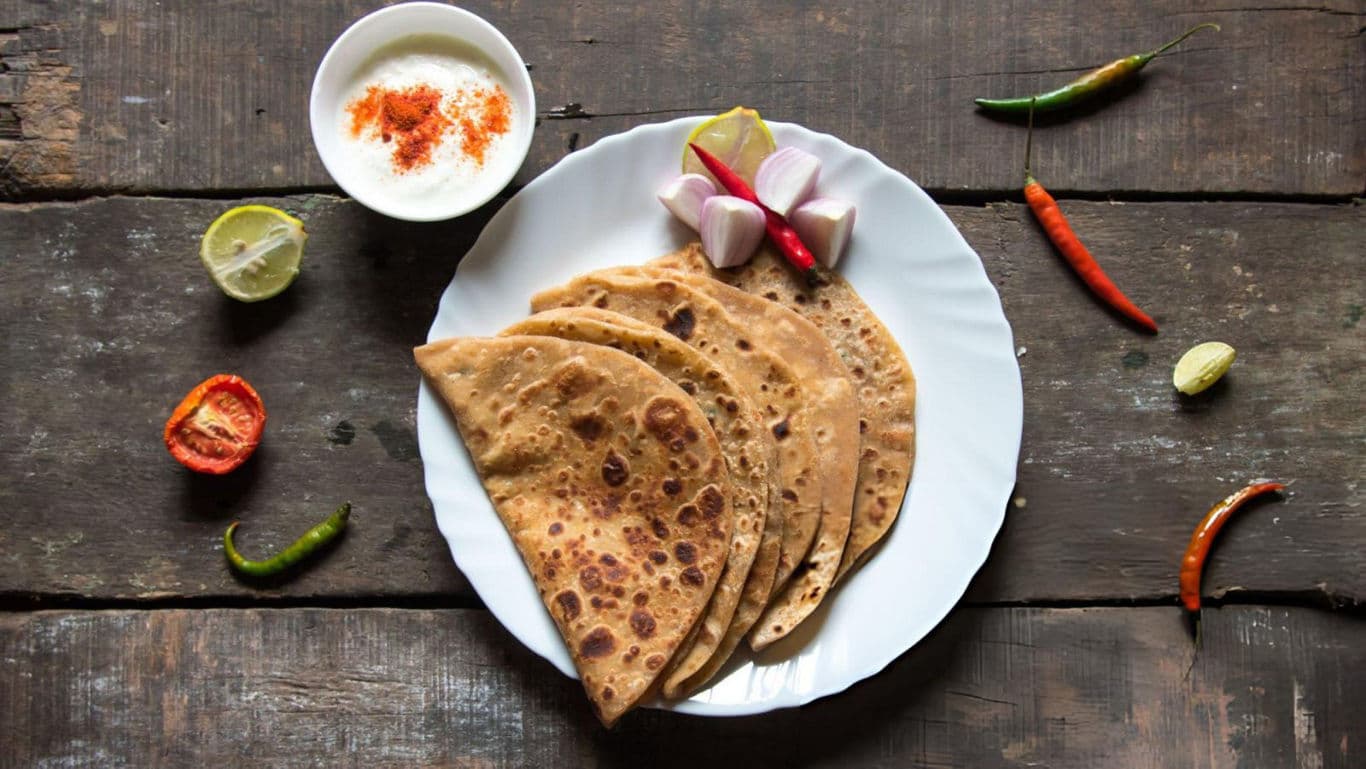 Soft parathas on a plate