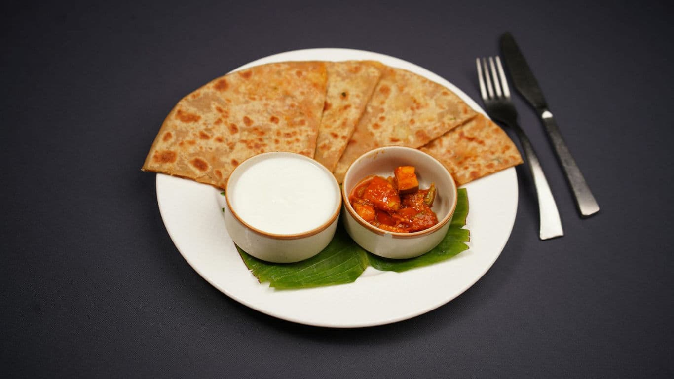 Indian flatbread with yogurt and pickle