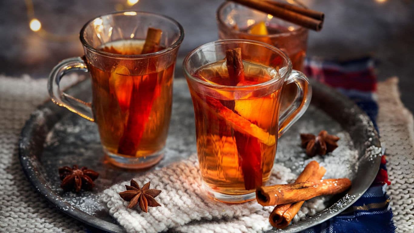 Warm spiced tea with cinnamon sticks