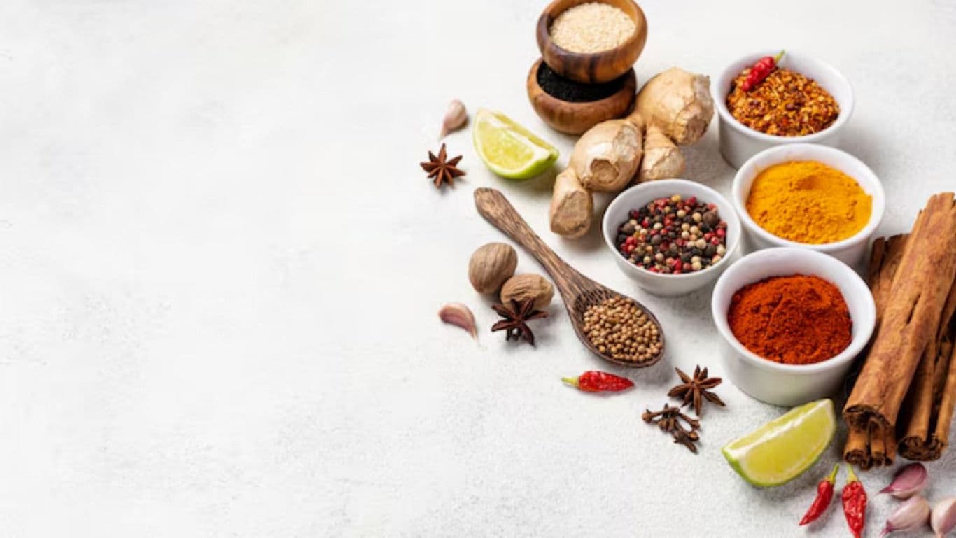 Assorted Colorful Spices and Herbs on White Table