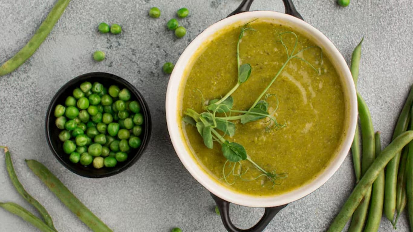 Fresh green pea soup with garnish