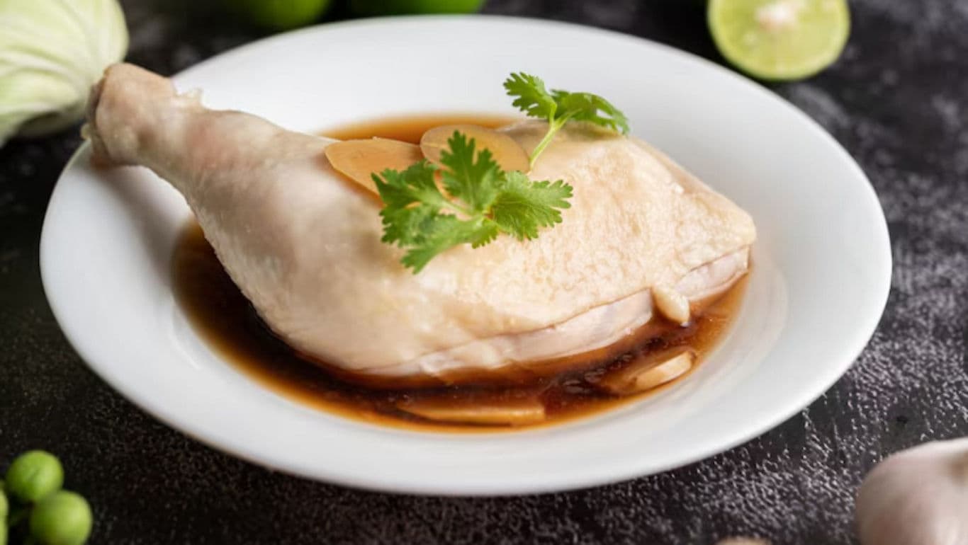 Steamed Chicken Leg with Soy Sauce Garnished with Cilantro