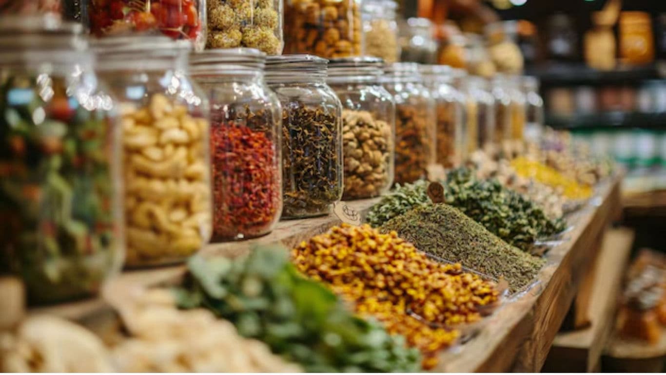 Glass jars with spices and herbs on display