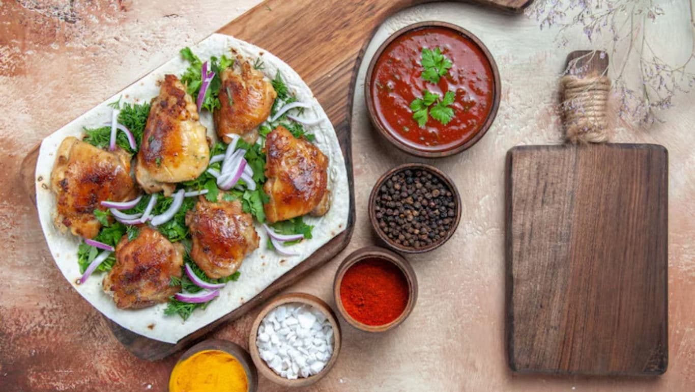 Grilled chicken thighs with spices and sauce