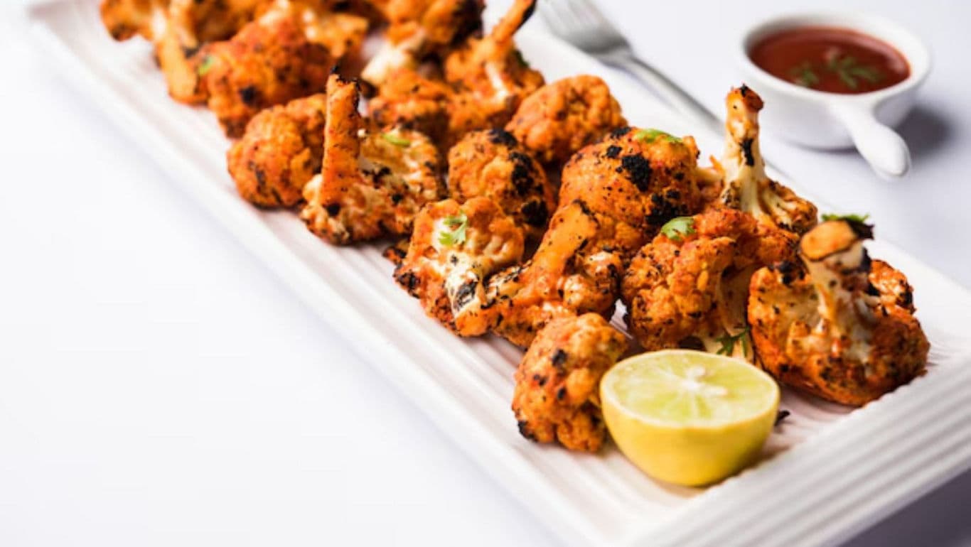 Grilled Cauliflower Appetizer with Lemon Garnish