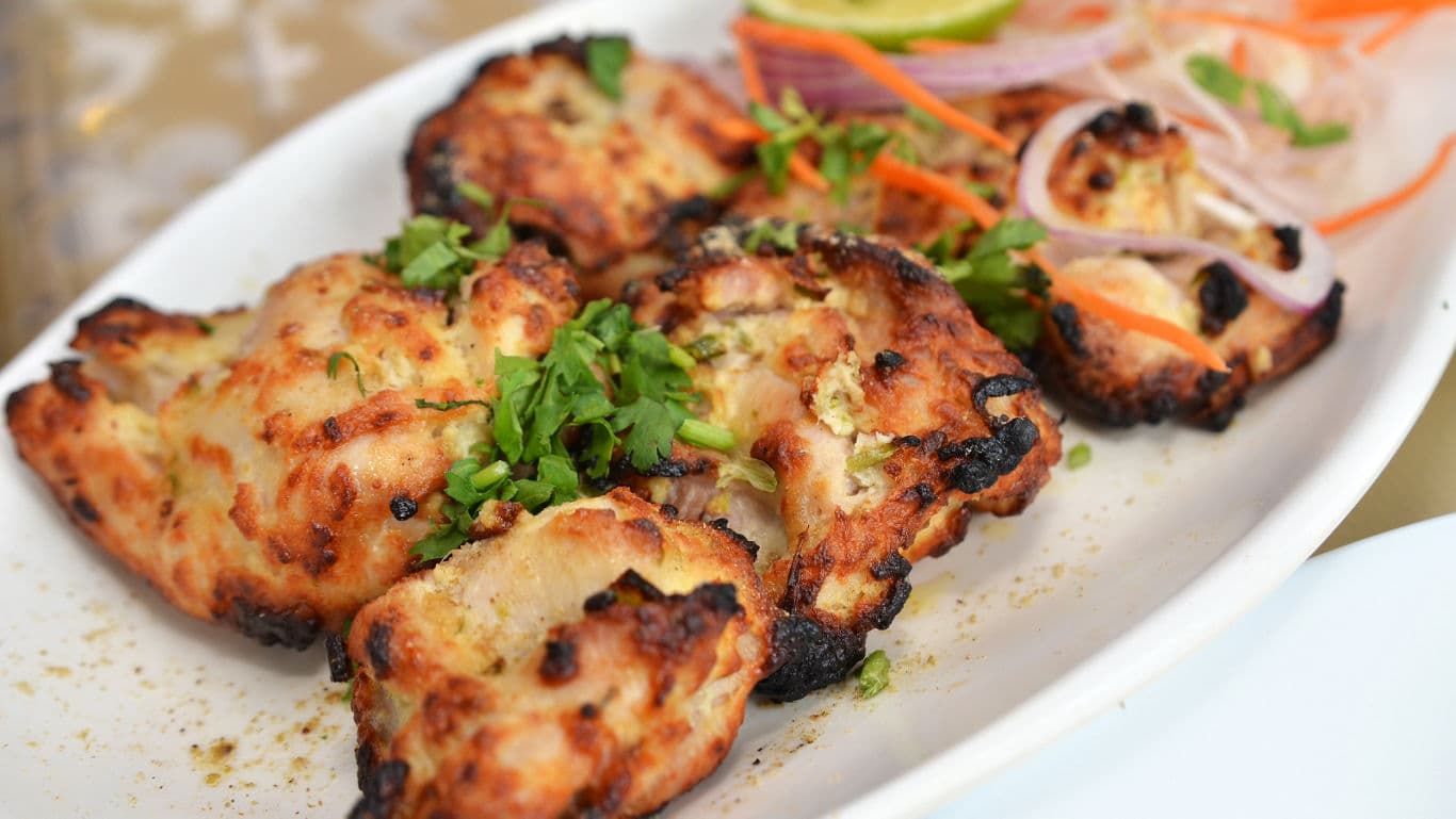 Grilled chicken with fresh garnish