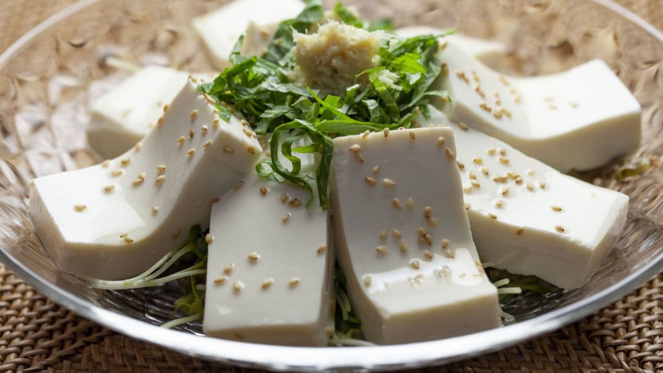 Chilled tofu slices with sesame and fresh herbs
