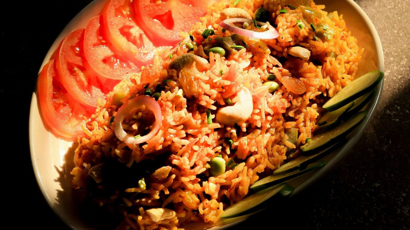 Spiced rice dish with fresh vegetables