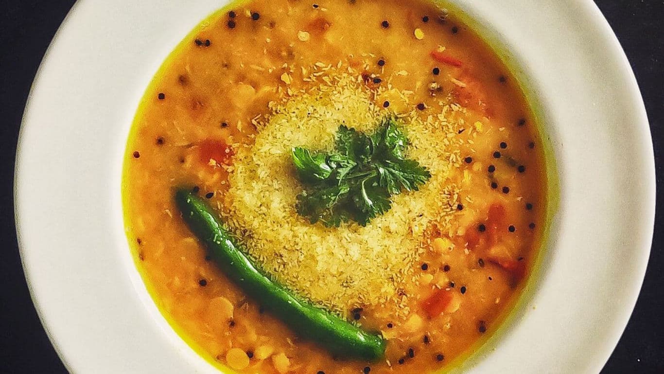 Spicy lentil soup with garnish