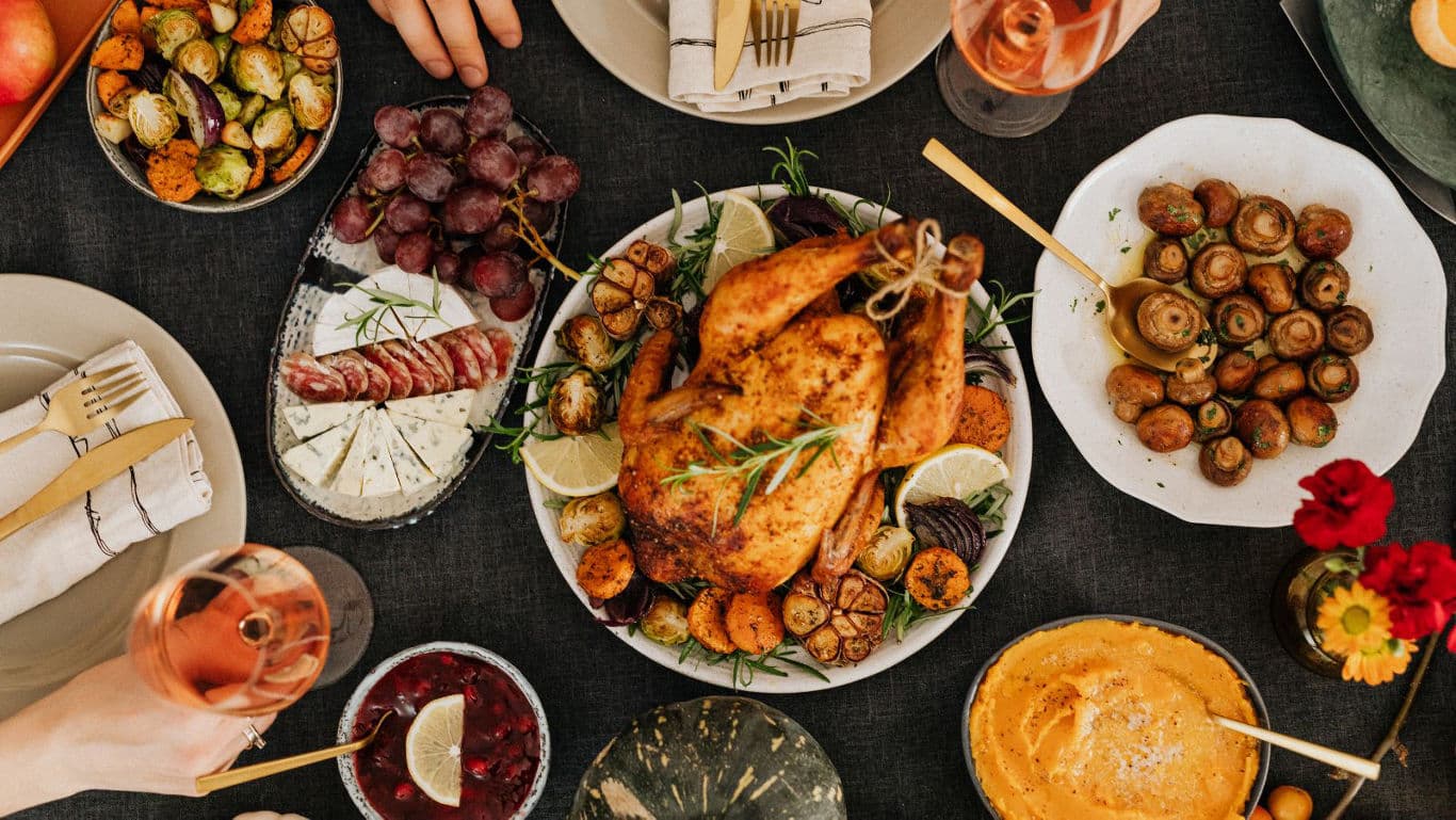 Festive dinner table with roasted chicken