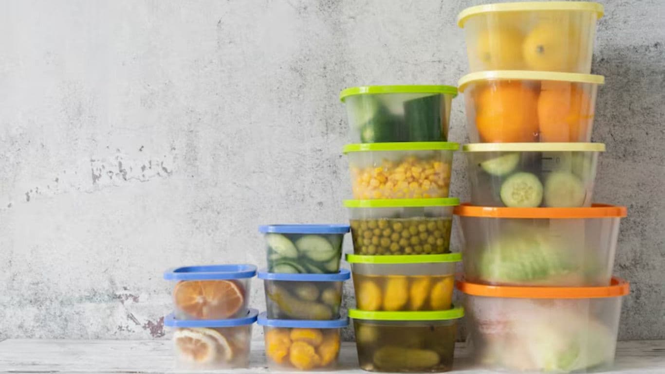 Stacked plastic food containers with fresh produce