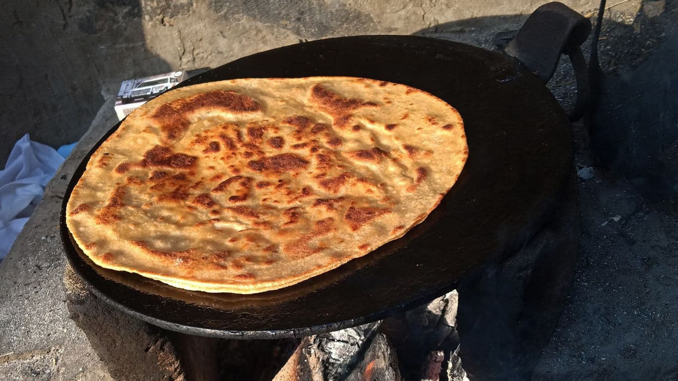 Flatbread cooking on traditional stove