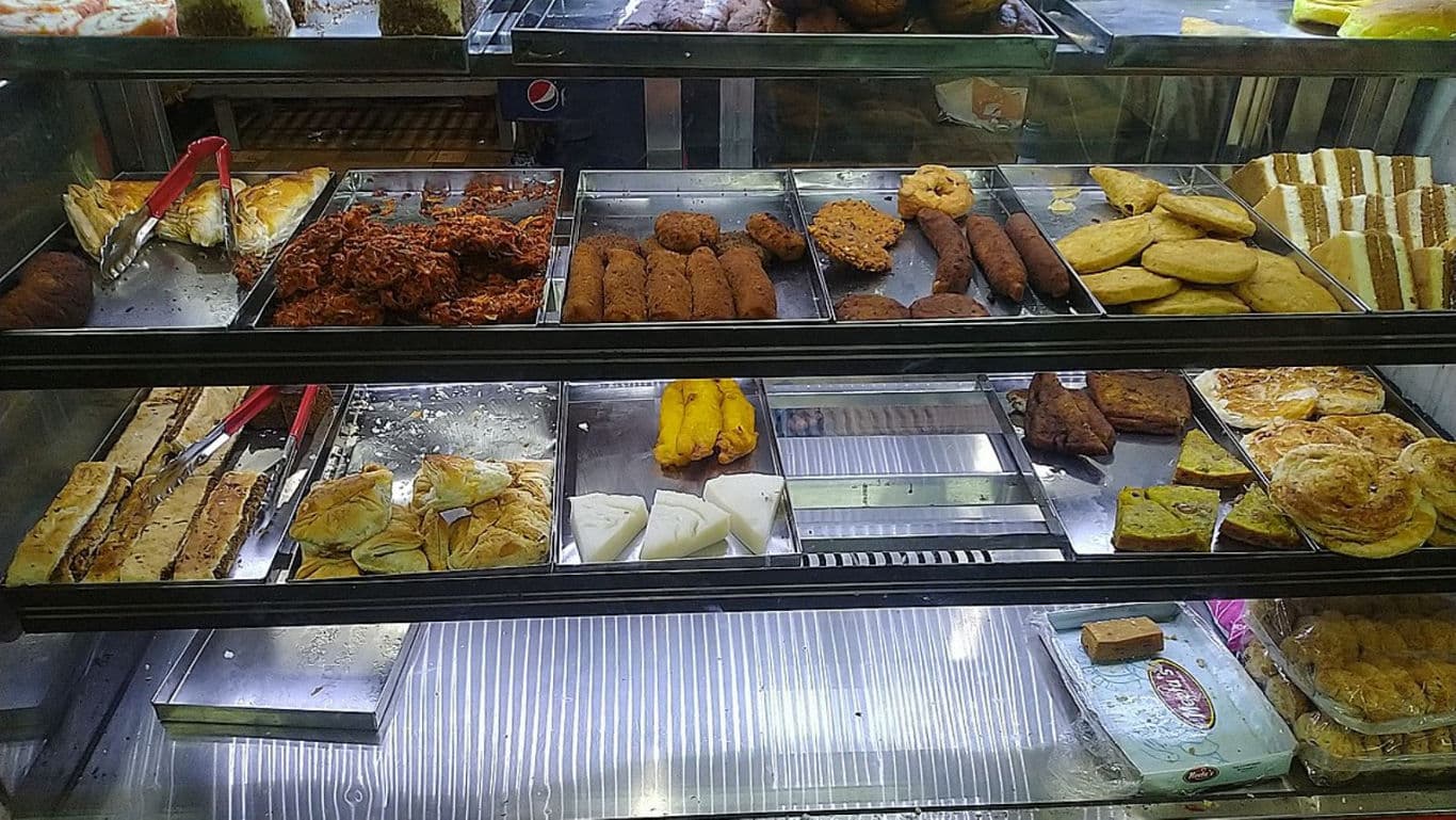 Assorted Indian Snacks and Sweets in Display Case