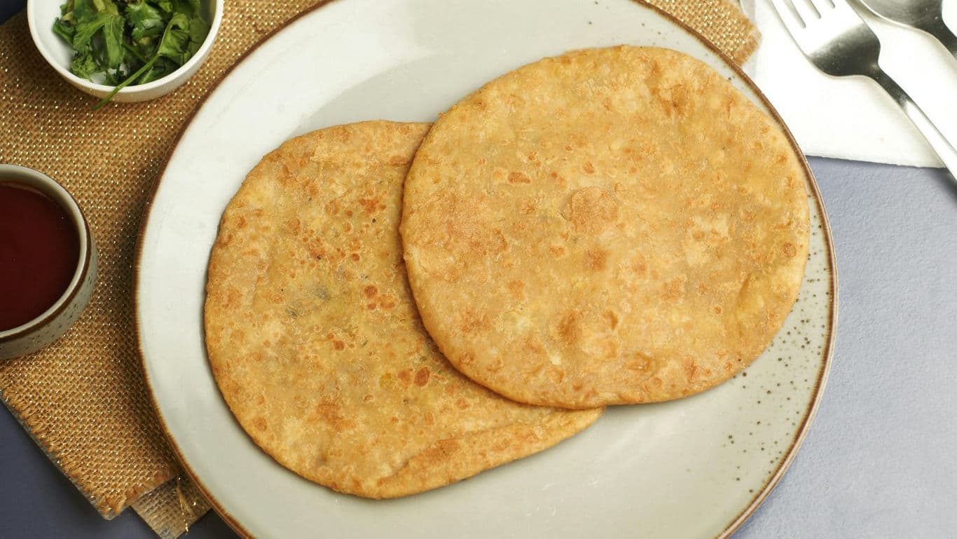 Two stuffed flatbreads on a plate