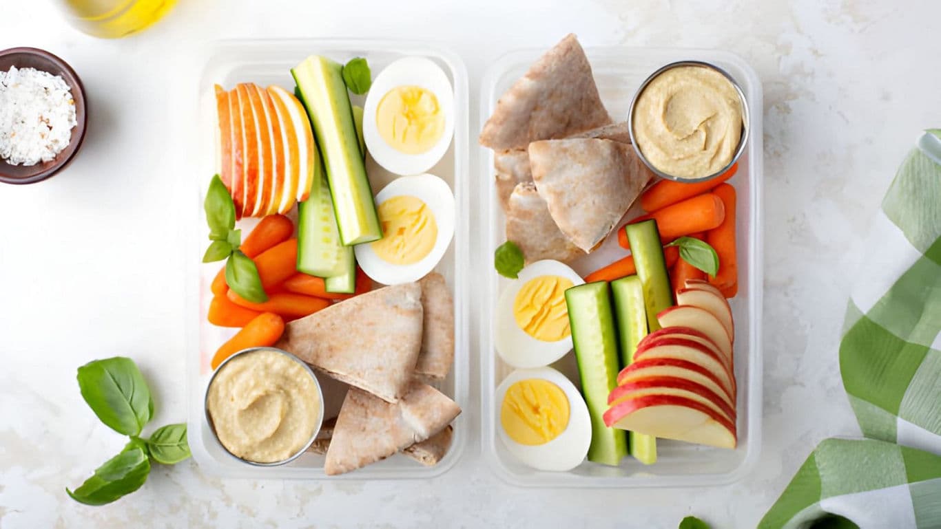 Healthy snack boxes with eggs and hummus