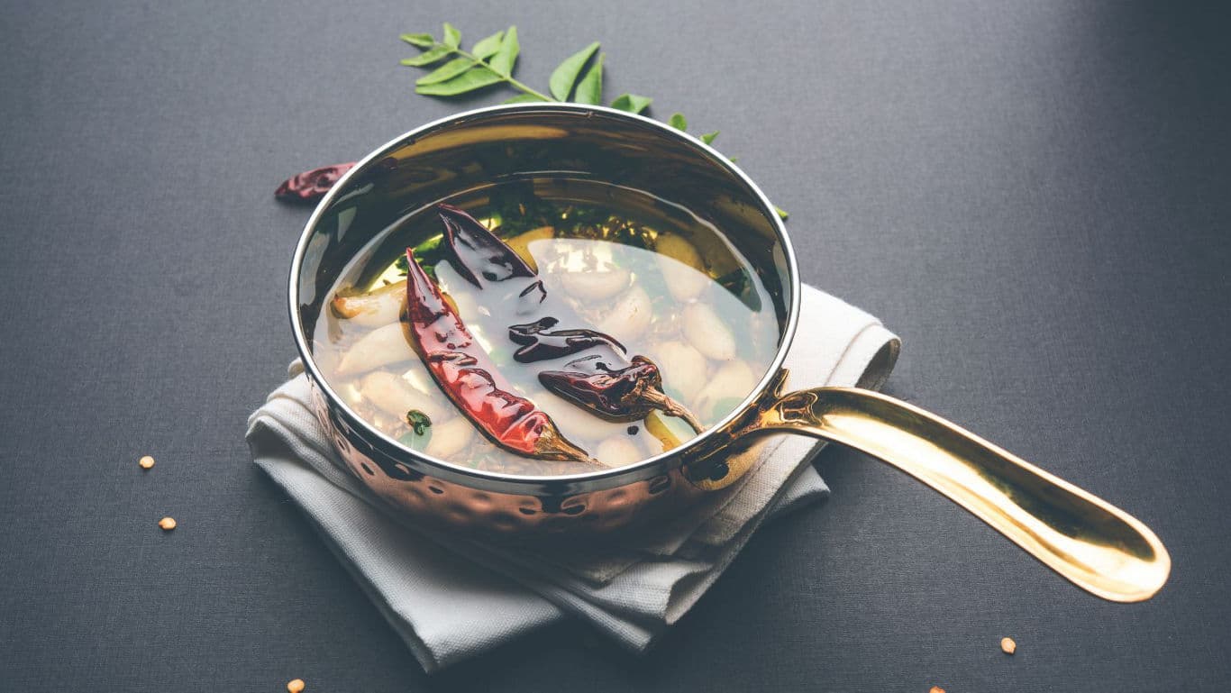Copper pan with spicy Indian curry