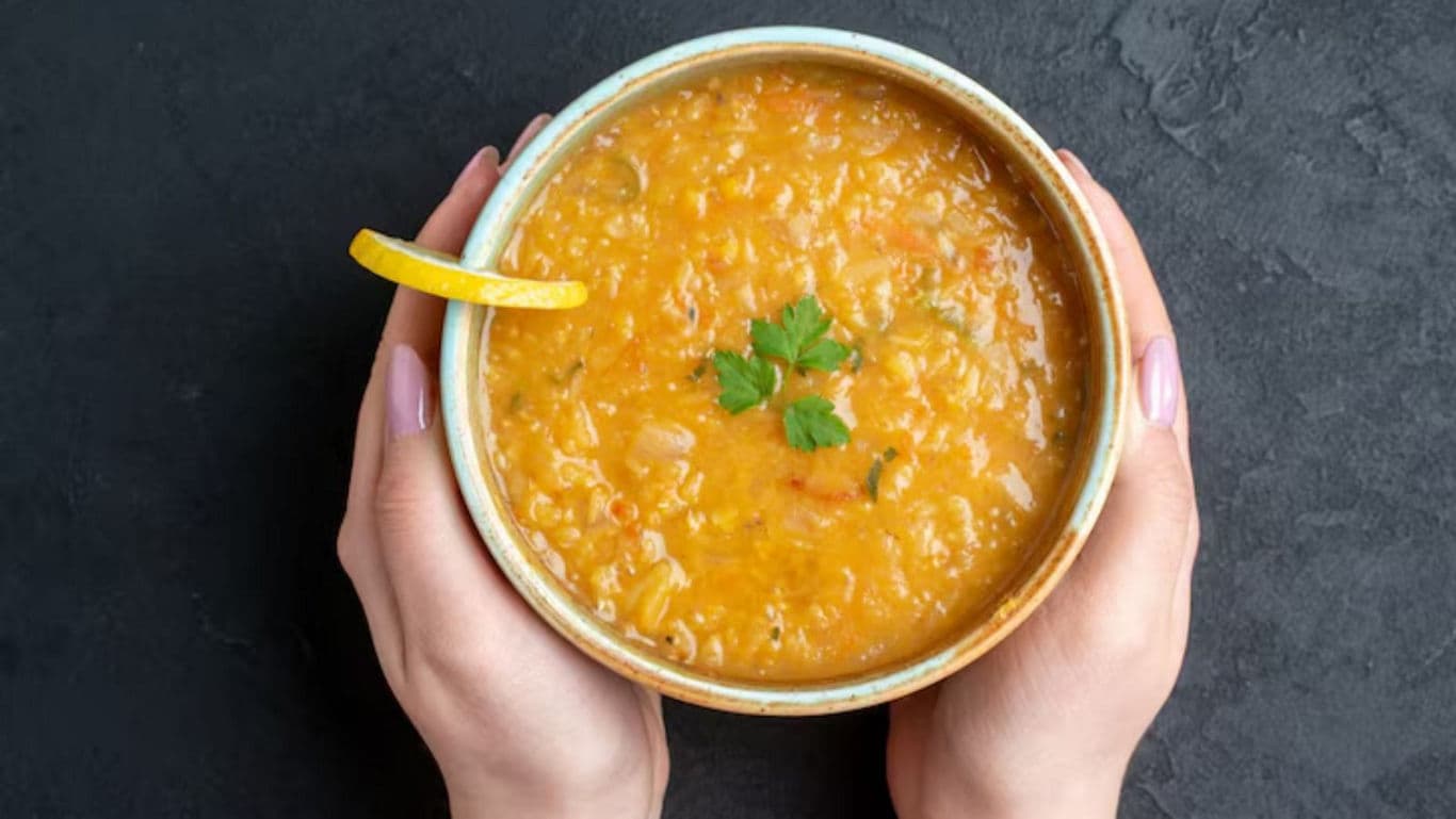 Bowl of lentil soup with garnish