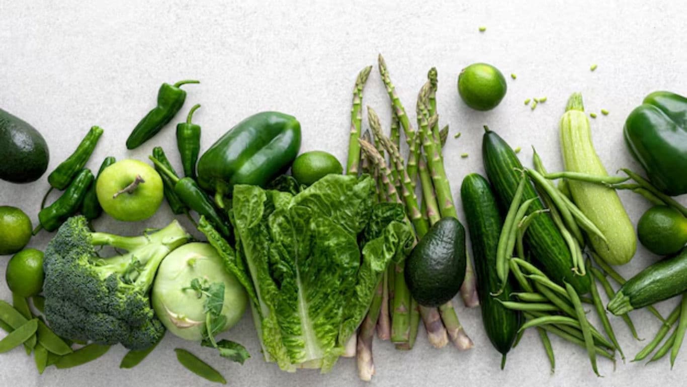 Fresh green vegetables on light background