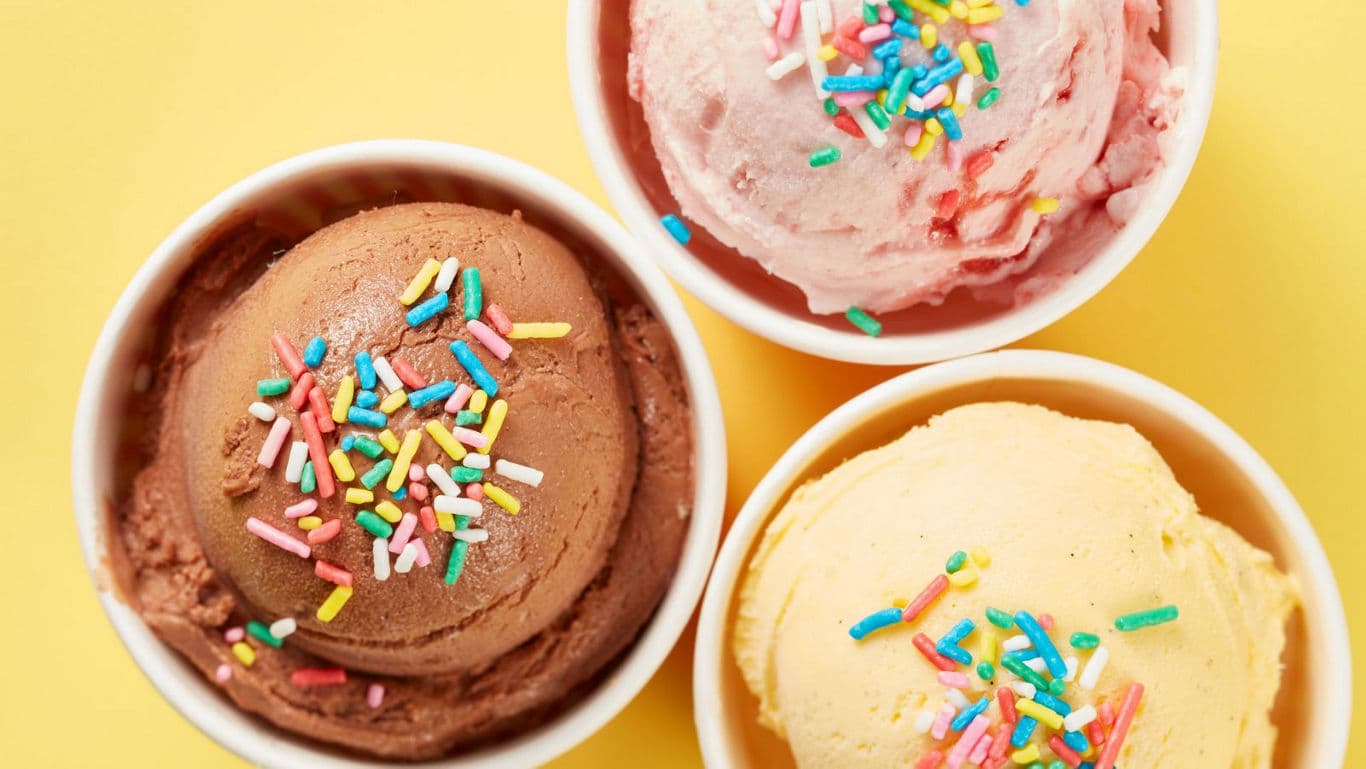 Three bowls of ice cream with colorful sprinkles