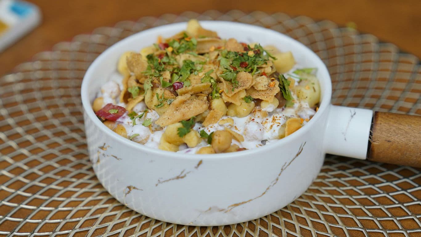 Chickpea yogurt chaat in marble ceramic bowl