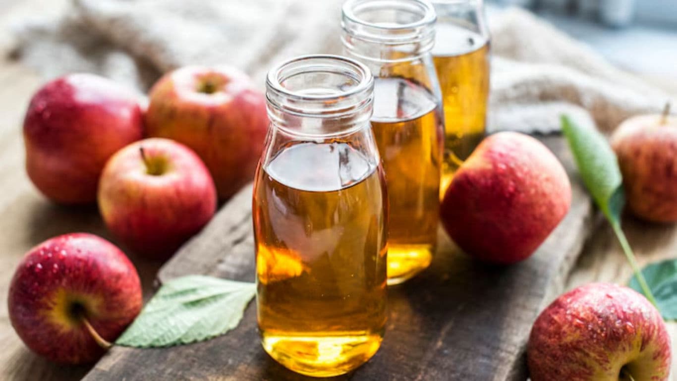 Fresh apple juice in glass bottles