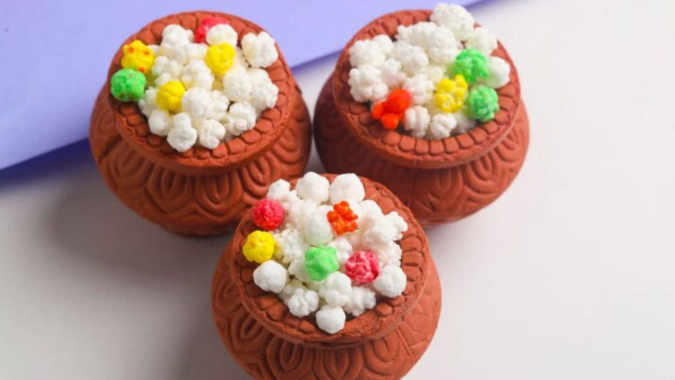 Clay pots with colorful decorative toppings