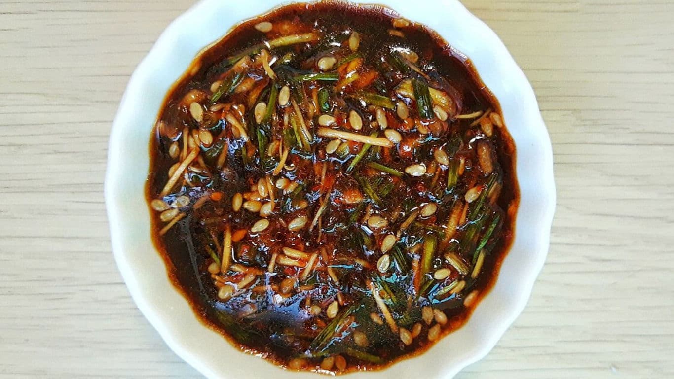 Bowl of savory soy-based dipping sauce