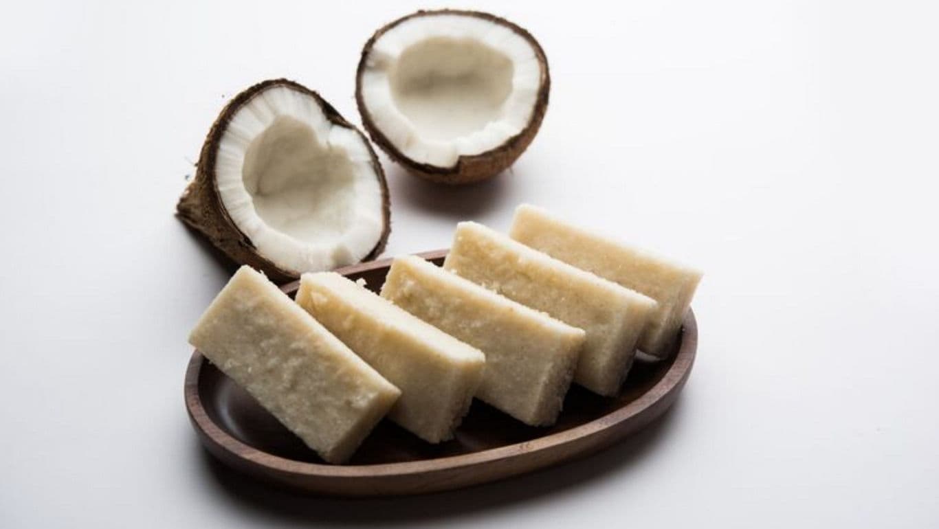 Coconut slices on wooden tray