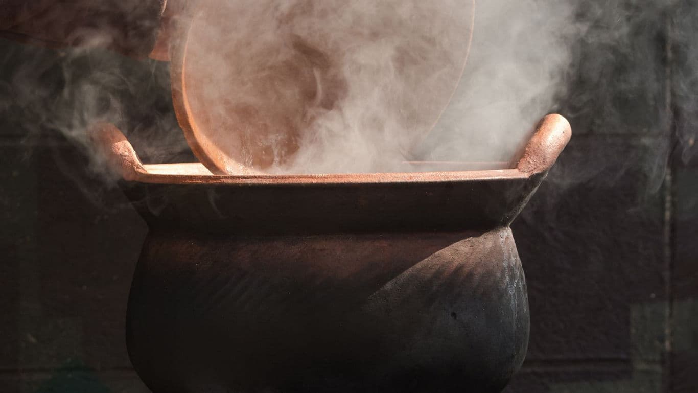 Steaming clay pot with rustic lid