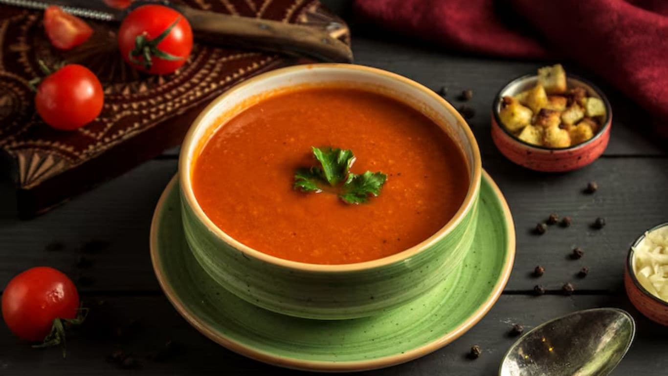 Bowl of tomato soup with garnish