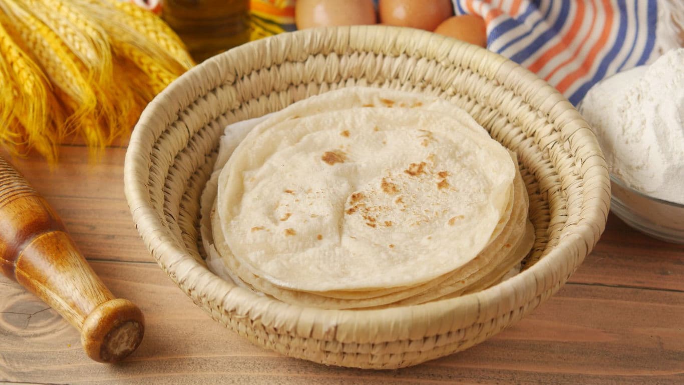 Fresh flatbreads in woven basket
