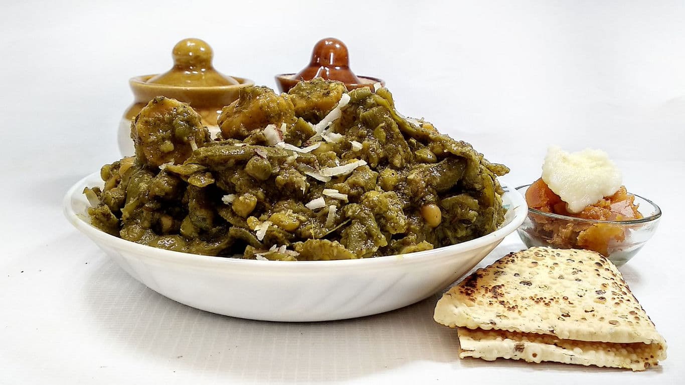 Traditional Indian green vegetable curry with flatbread