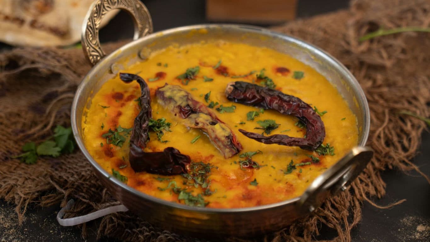 Traditional Indian dal tadka with dried red chilies