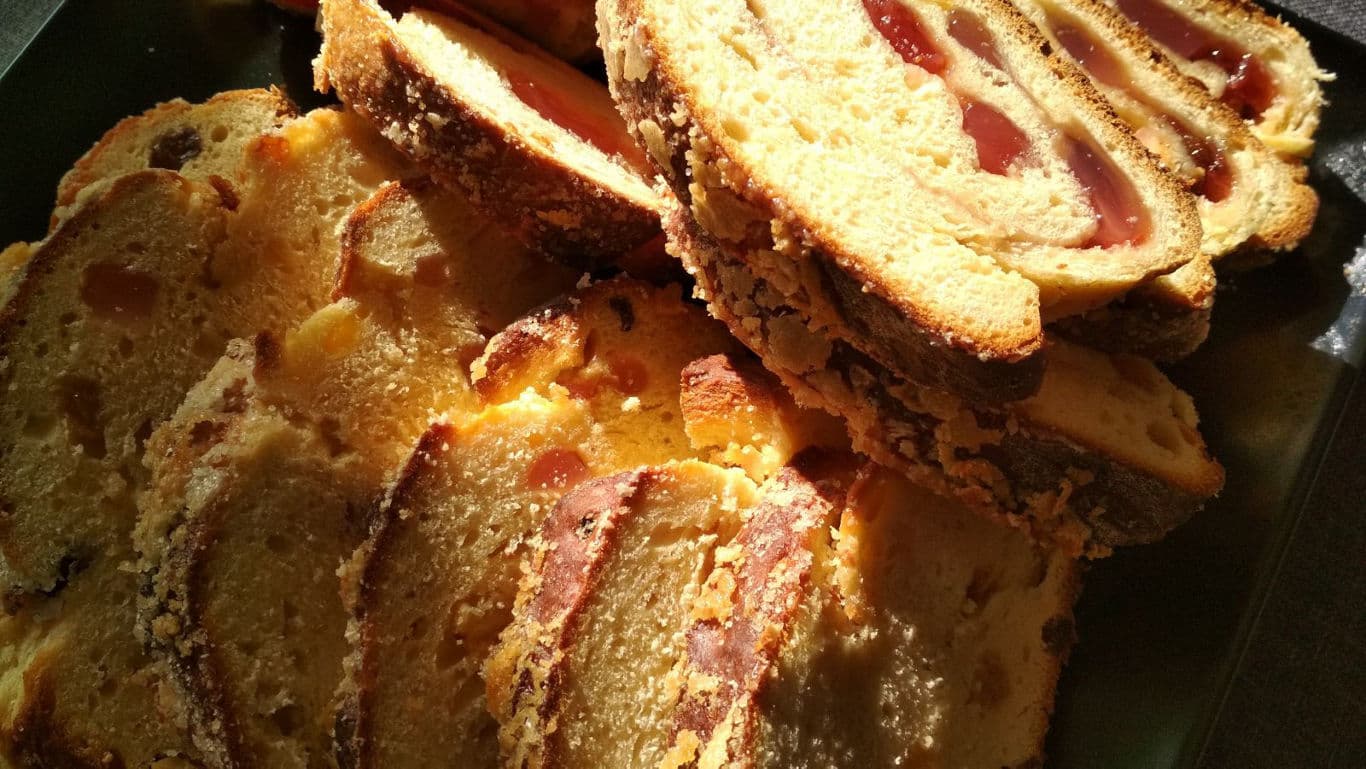 Sliced fruit-filled pastry in warm light