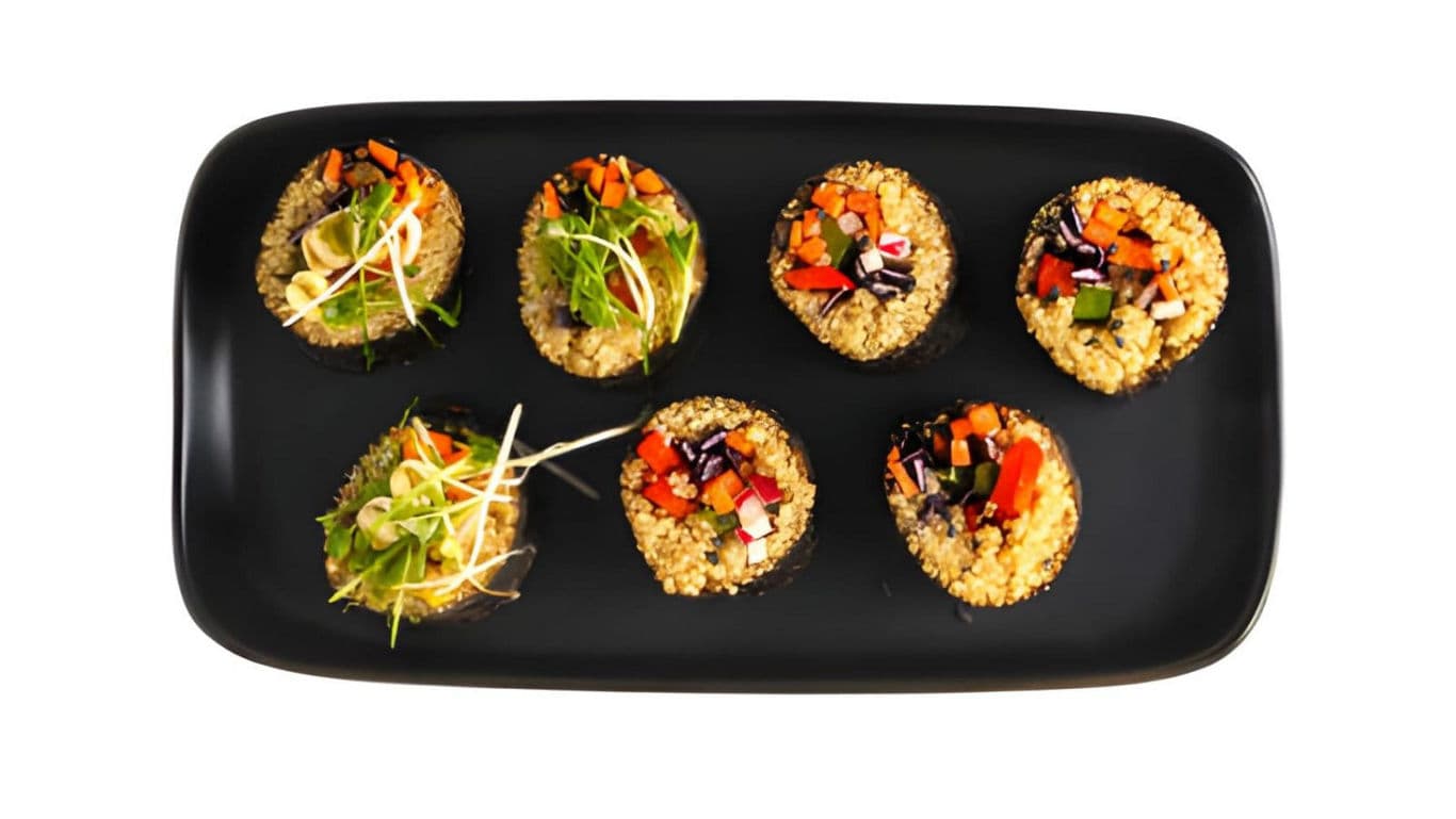 Colorful quinoa bites on black plate