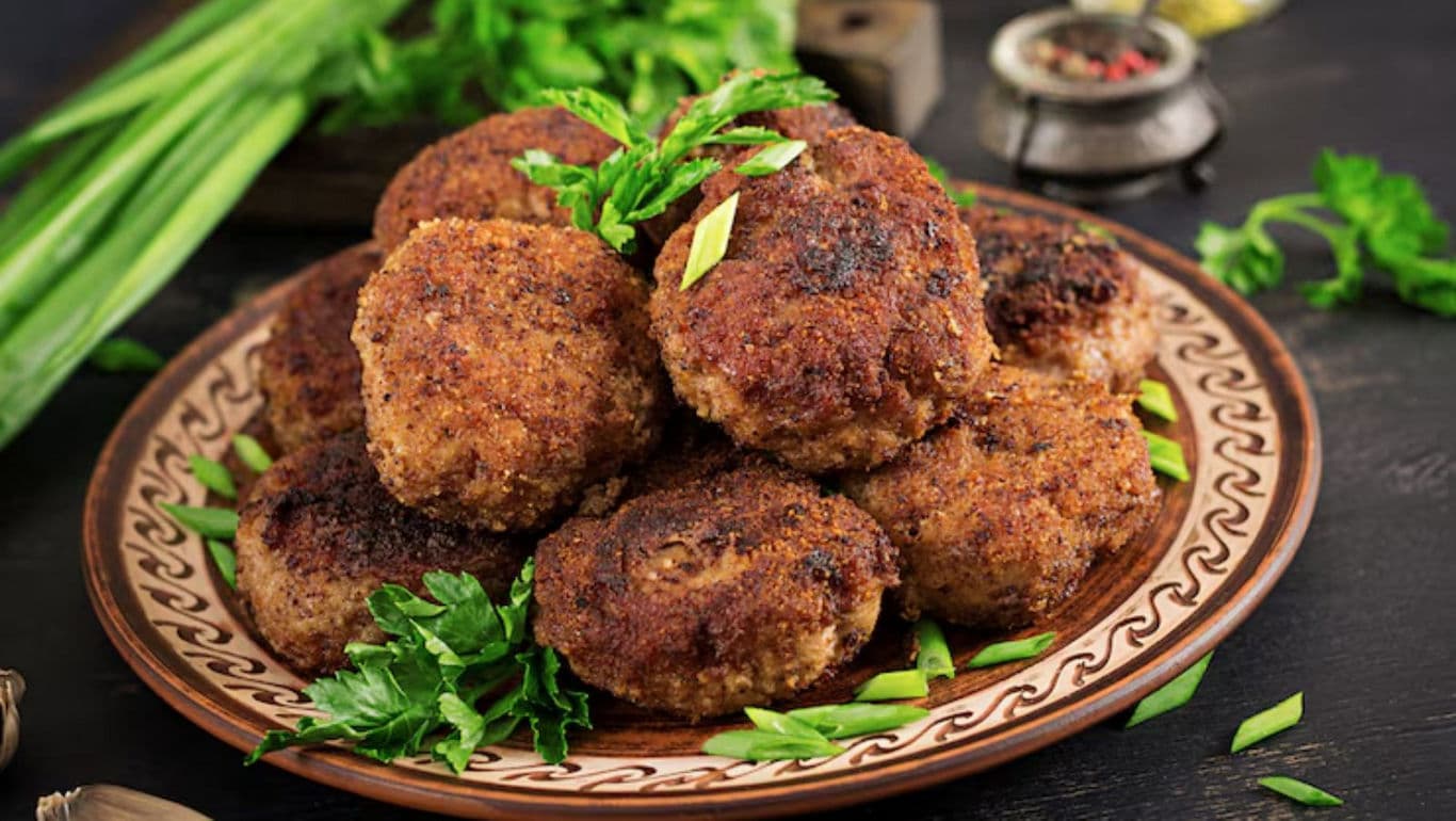 Homemade meat cutlets served on rustic ceramic plate