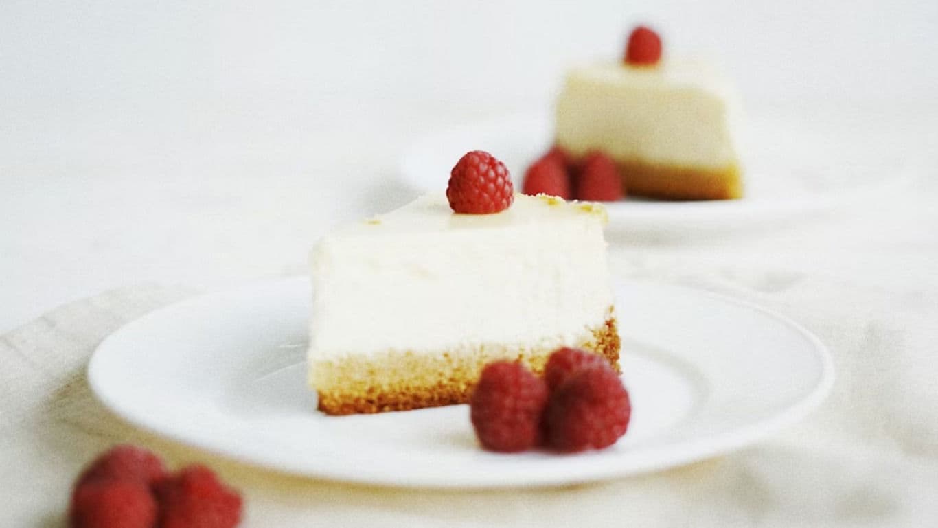 Slice of Cheesecake with Fresh Raspberries