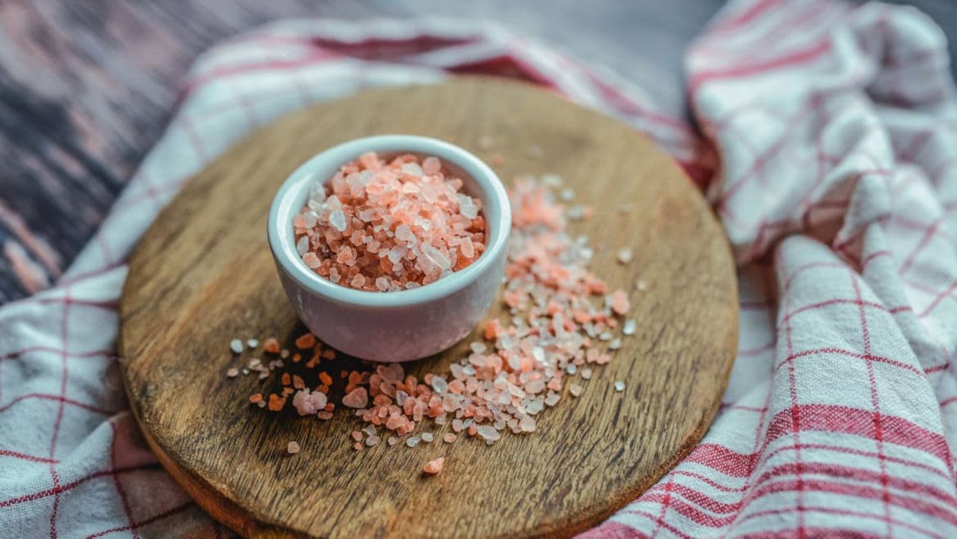 Pink Himalayan salt in white bowl