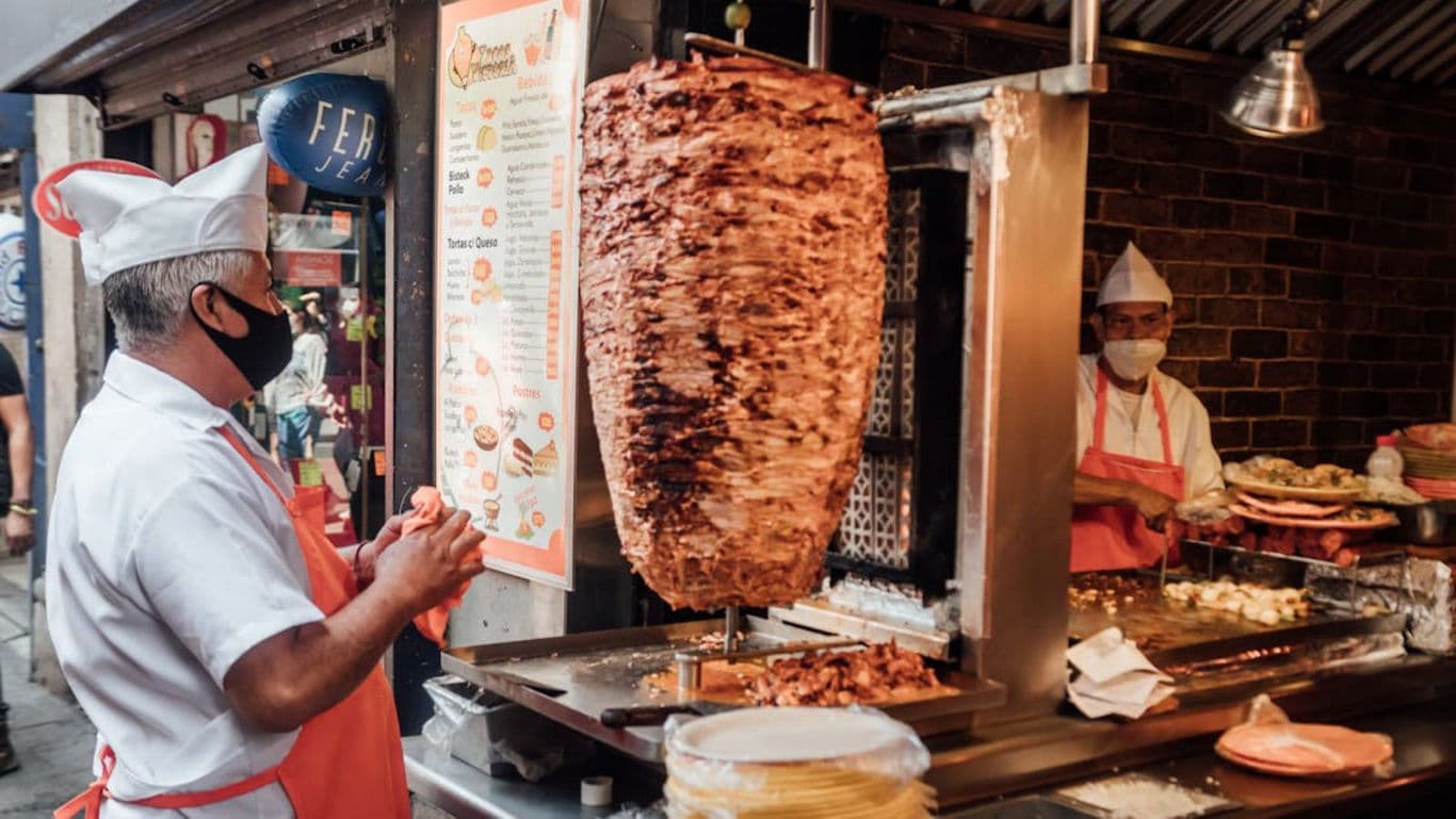 Street vendor preparing shawarma at food stall