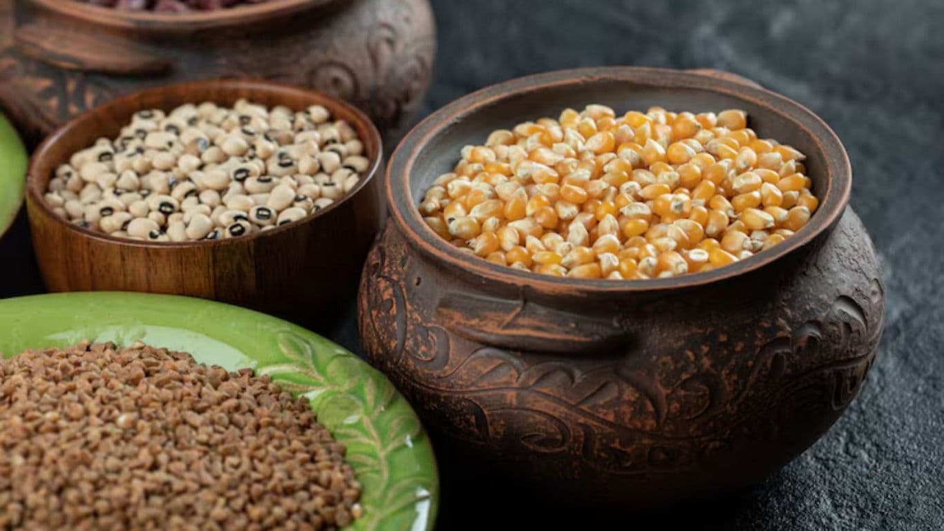 Assorted grains in rustic ceramic bowls