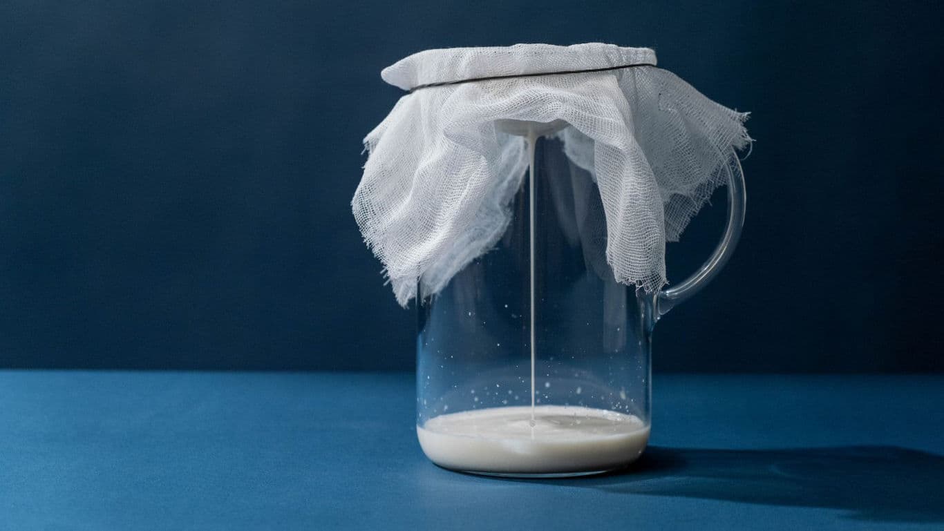 Glass Jar with Straining Cloth and Milk