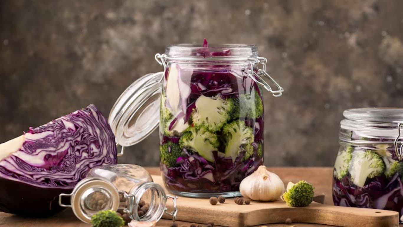 Glass jars filled with pickled vegetables
