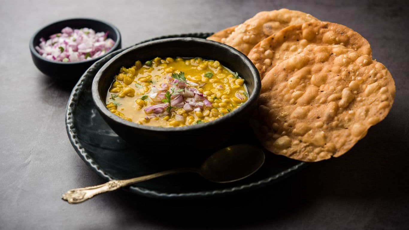 Traditional Indian dal with crispy papad