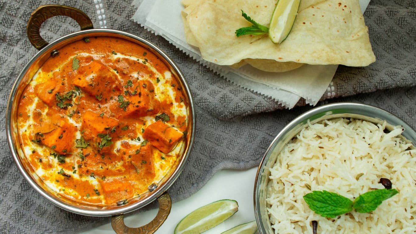 Indian curry with rice and naan bread