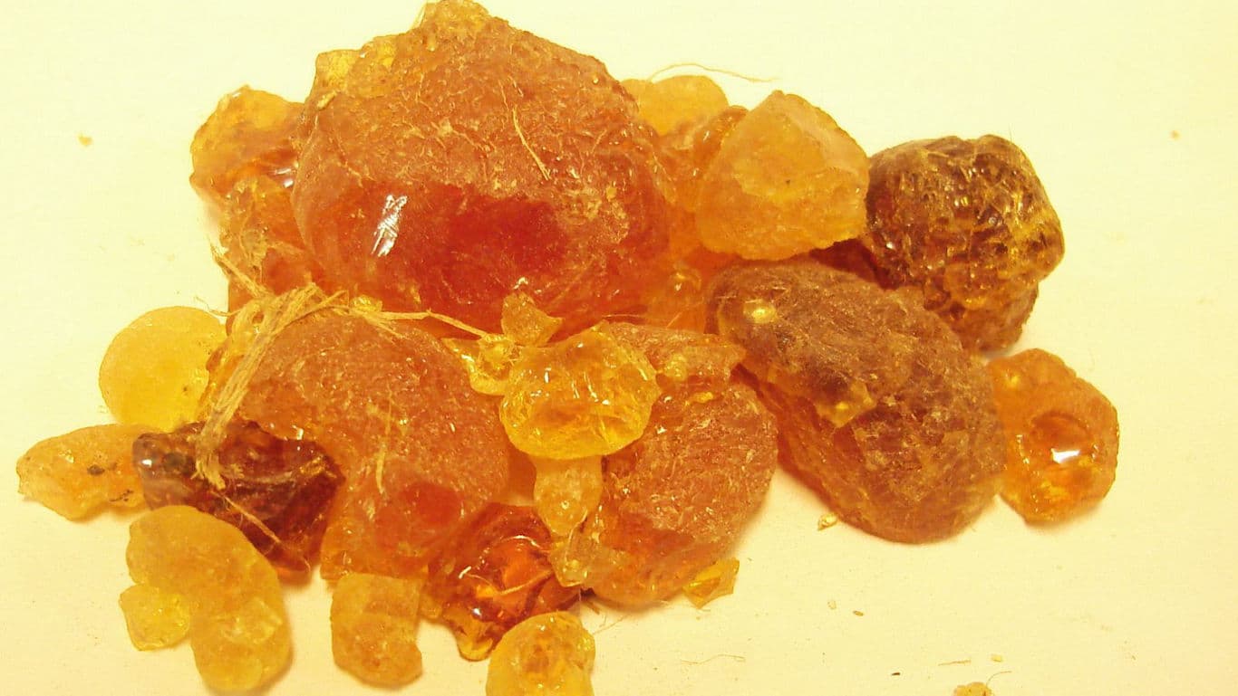 Golden resin chunks on neutral background