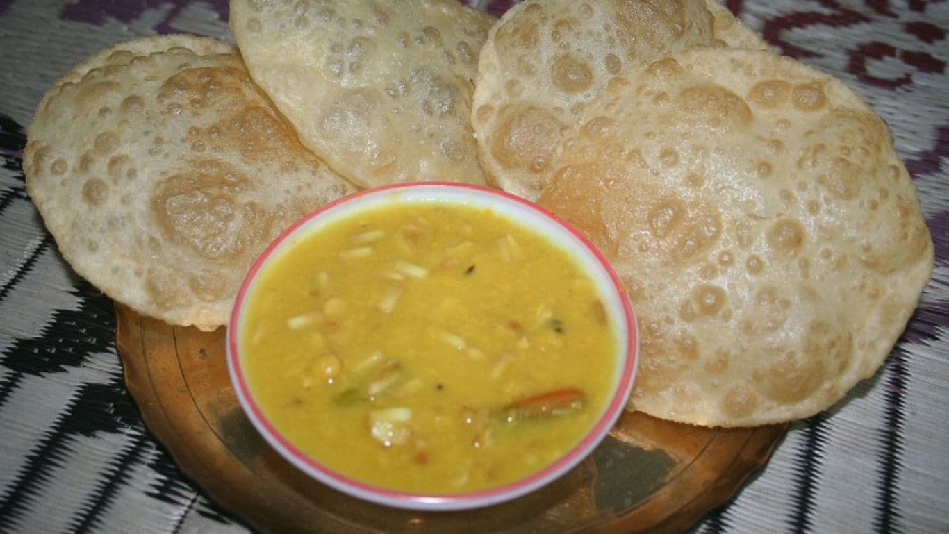 Traditional Indian puri with lentil curry