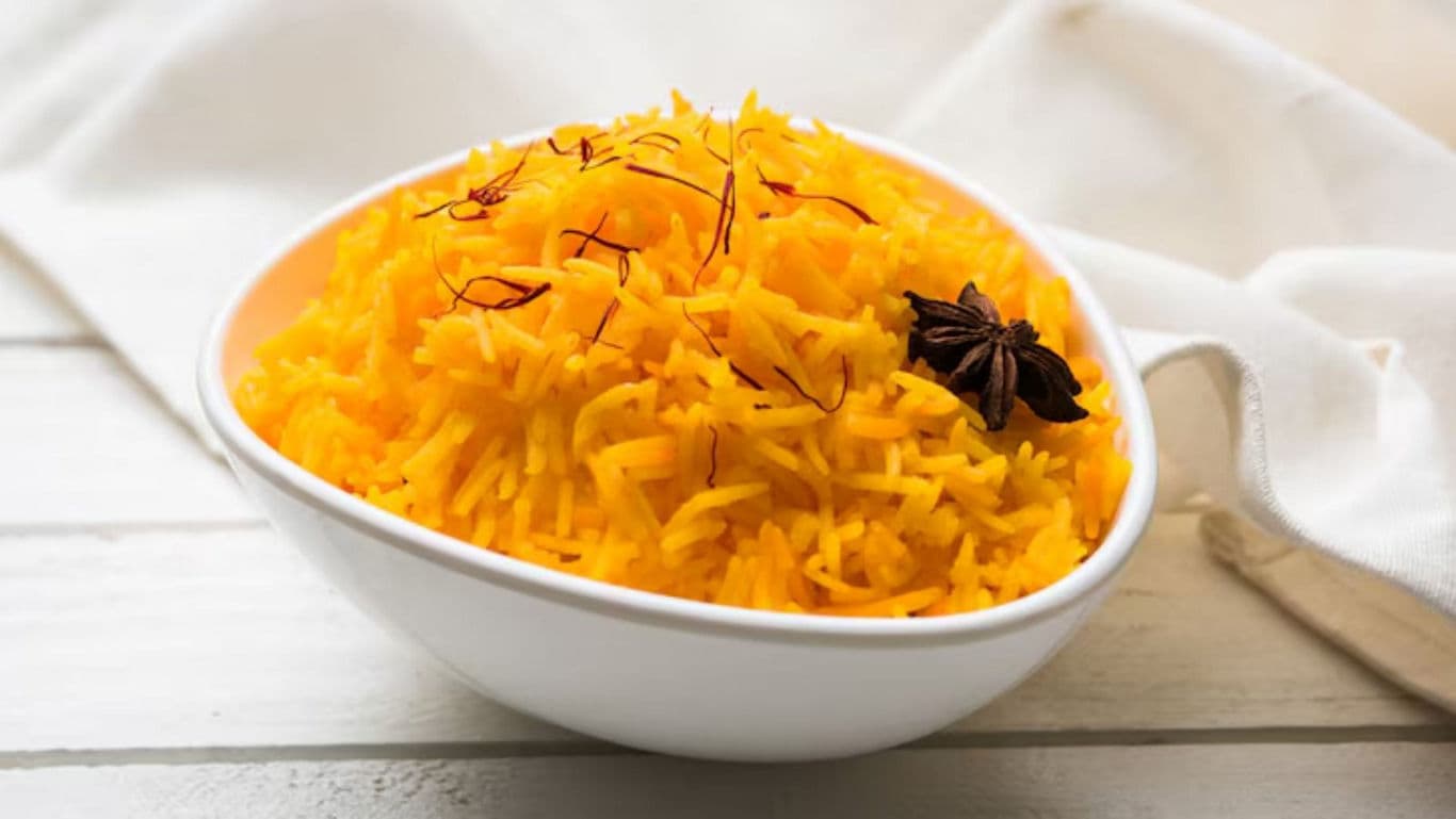 Bowl of saffron rice with star anise