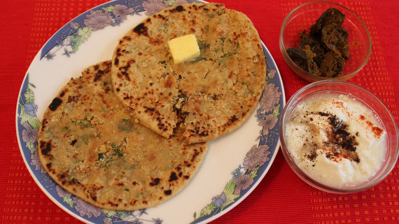 Stuffed parathas with butter and sides